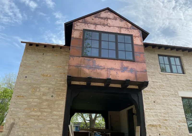 Copper metal panel facade on a stone building for Skylight Installation in Fort Belvoir